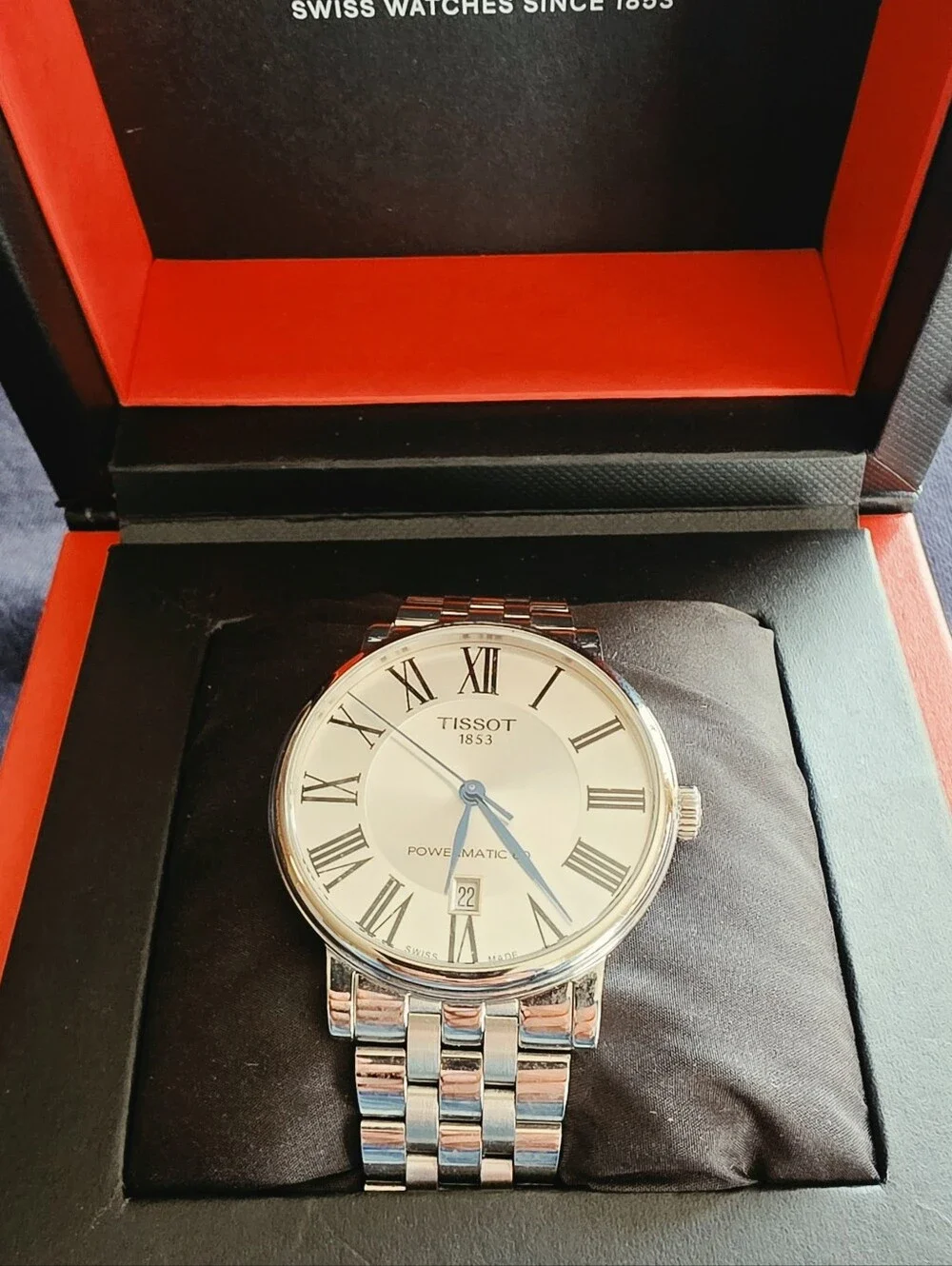 Tissot Silver Watch with Blue Hands and White Dial